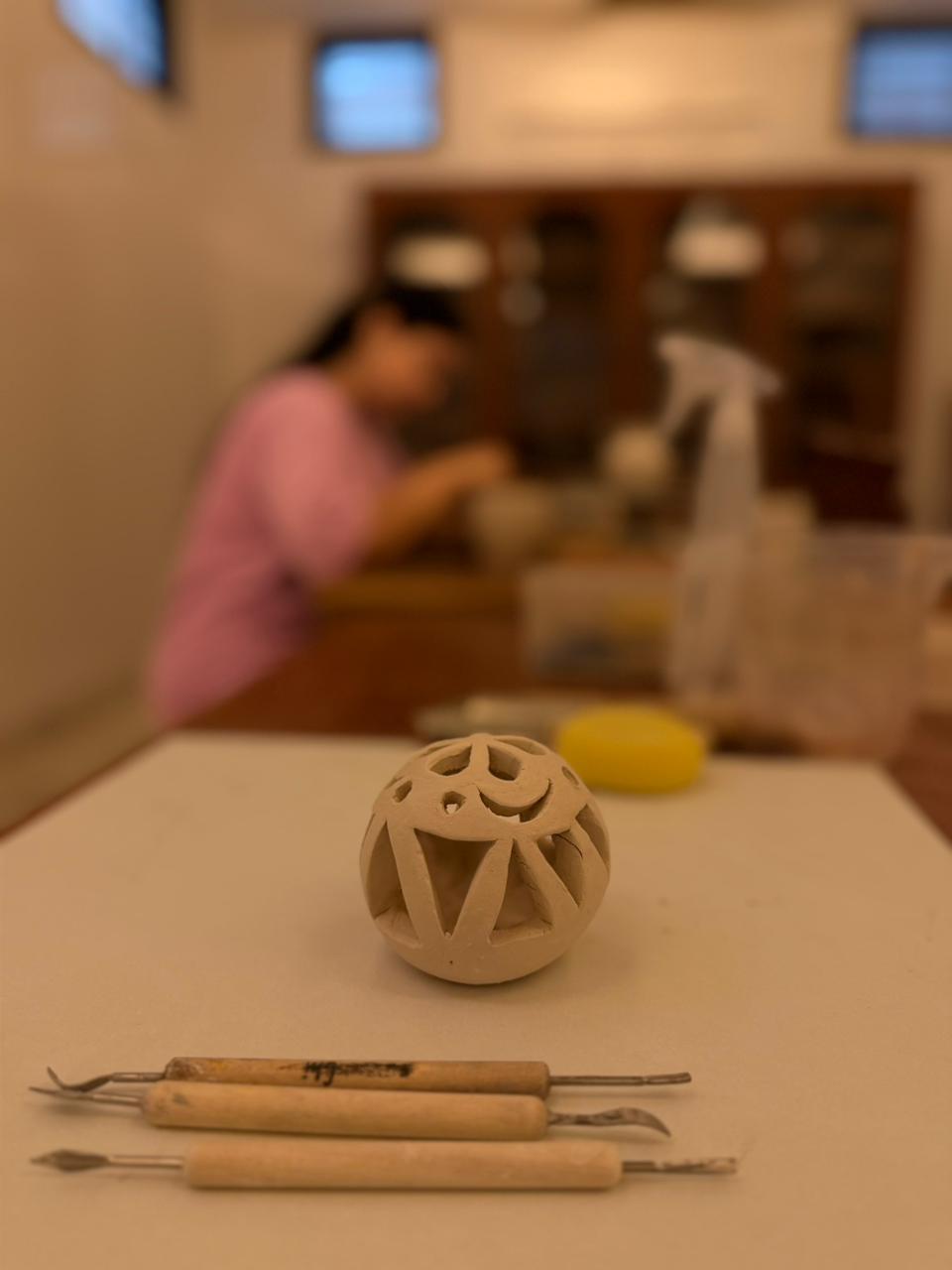 Hand-built carved clay sphere